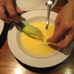 dipping stuffed zucchini in egg wash