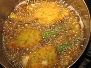 Stuffed Zucchini Blossoms frying in oil