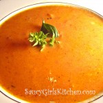 Bowl of Homemade Tomato Soup with Basil Garnish