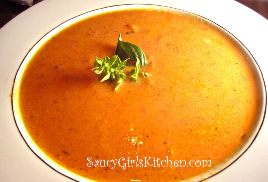 Bowl of Homemade Tomato Soup with Basil Garnish