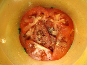 Next some sliced tomatoes, salt and pepper