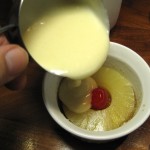 Pouring cake batter into prepared ramekin