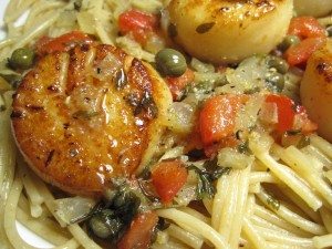 Scallop on pasta close up