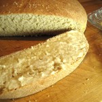 Sourdough Wheat Bread, sliced with butter on it