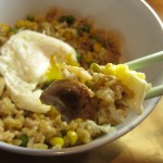 Chicken Fried Rice topped with a poached egg with broken yolk