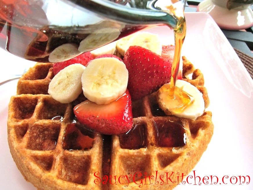 Pouring warm syrup on Corn & Wheat Waffles