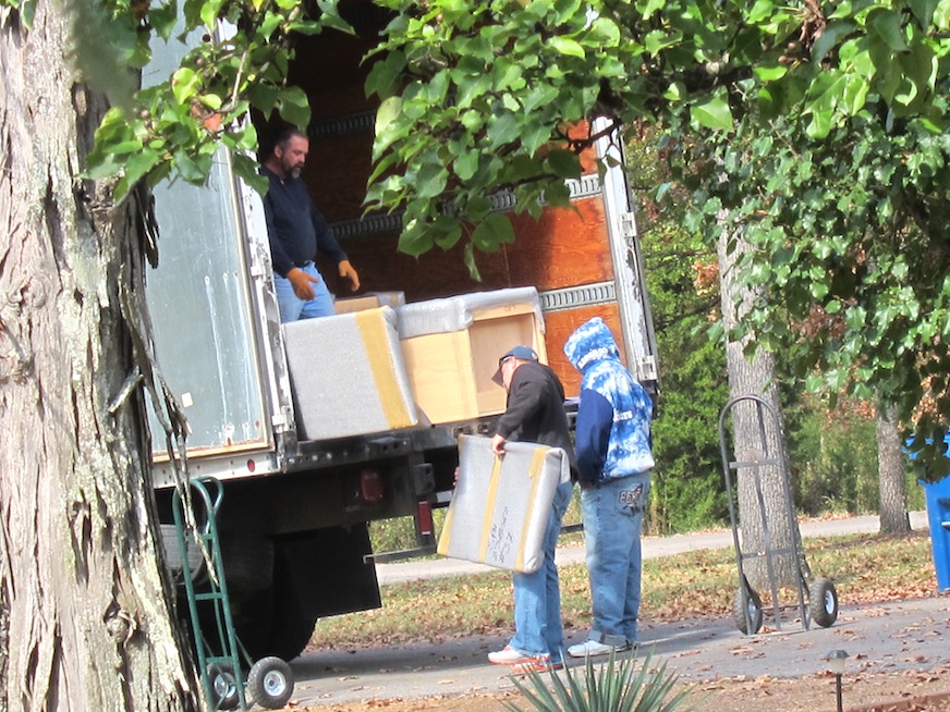 Unloading the kitchen cabinets from the truck