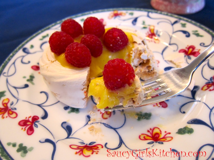 Taking a bite of the cream filled Pavlova